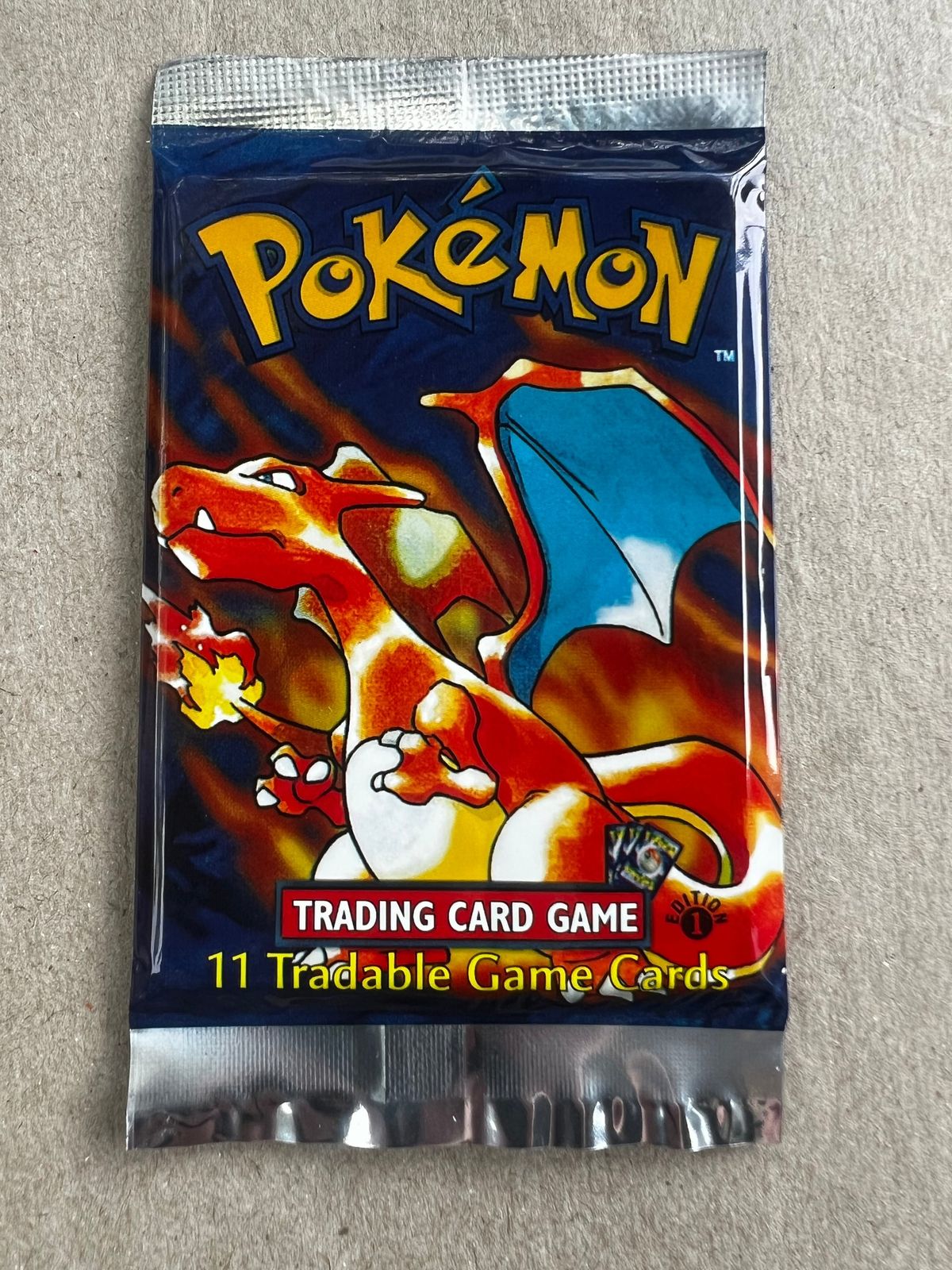 A counterfeit 1st Edition Base Set booster pack.