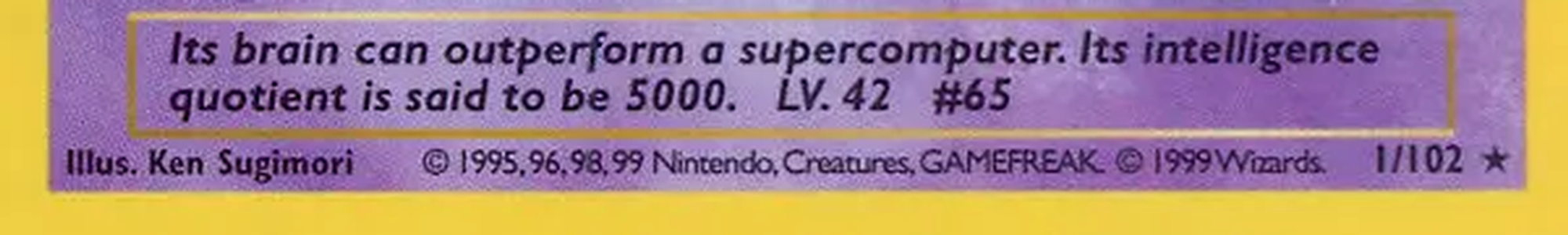 Bottom of a 1999 Base Set Alakazam: the collector number 1/102 beside a star rarity symbol at the bottom right, and a copyright line ending in 99.