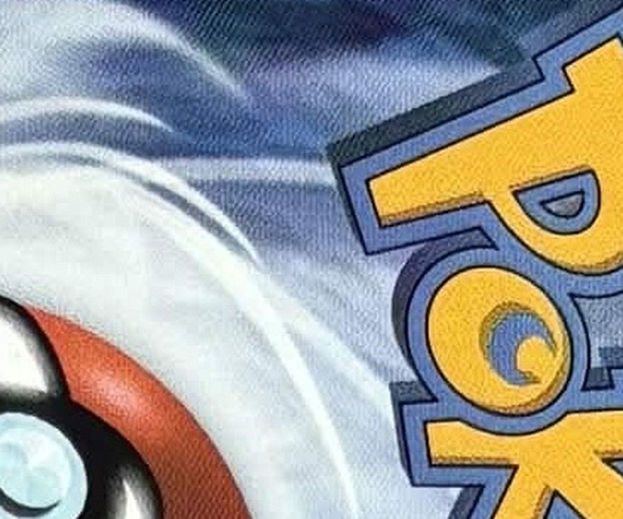 Close-up of the swirl above the Poké Ball on the genuine back: sharp edges between light and dark blue.
