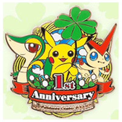 Tohoku first-anniversary logo pin, 2012: Snivy, Pikachu and Victini with a four-leaf clover.