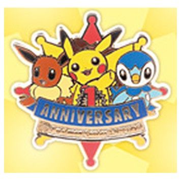 Sapporo first-anniversary logo pin, 2010: Eevee, Pikachu and Piplup over an ANNIVERSARY ribbon.