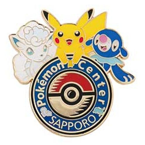 Logo pin of Pokémon Center Sapporo, 2016: Alolan Vulpix, Pikachu and Popplio over the Poké Ball medallion, the emblem of 2016 to 2019.