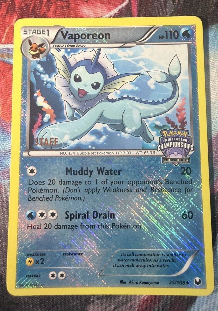 A Vaporeon Dark Explorers STAFF promo: fine crosshatched foil over the whole card, STAFF stamp on the artwork.