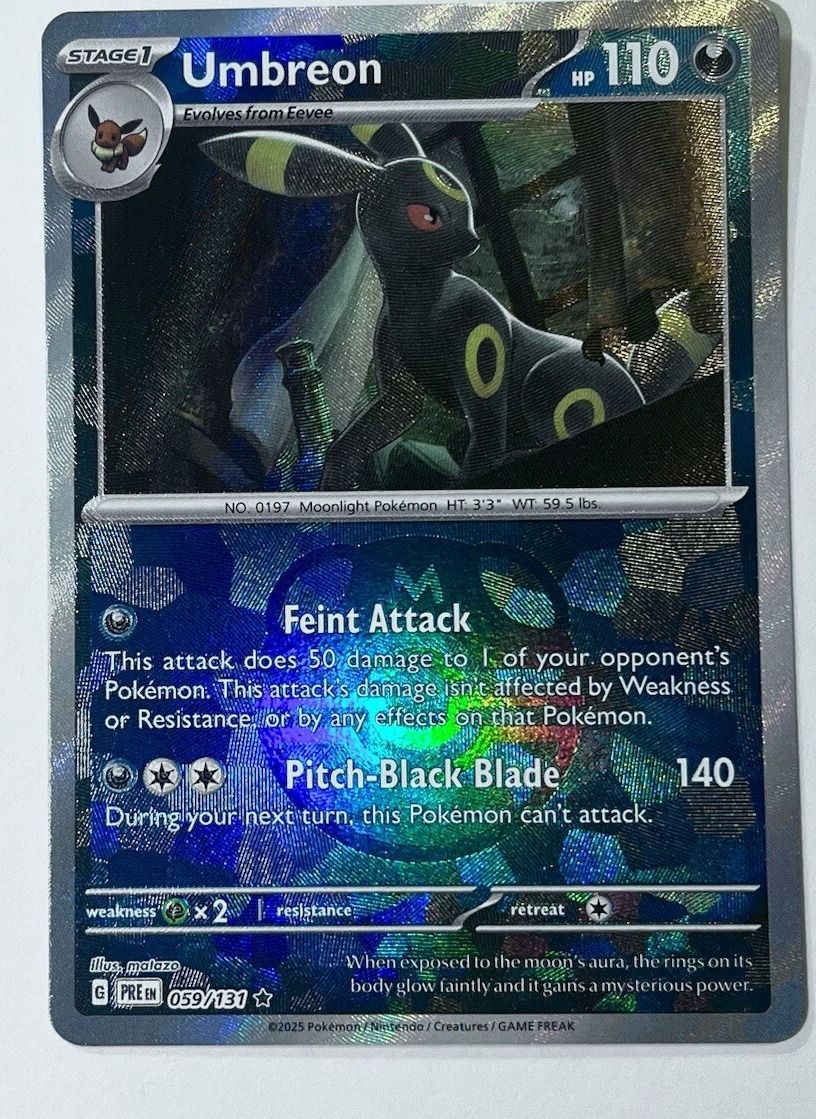 A Master Ball pattern reverse holo Umbreon from Prismatic Evolutions.