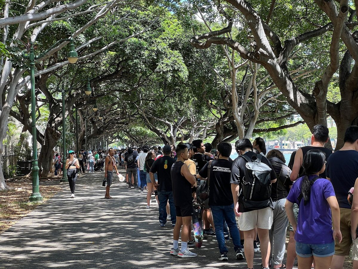 A long outdoor queue for the official Pokémon store at the 2024 World Championships in Honolulu.