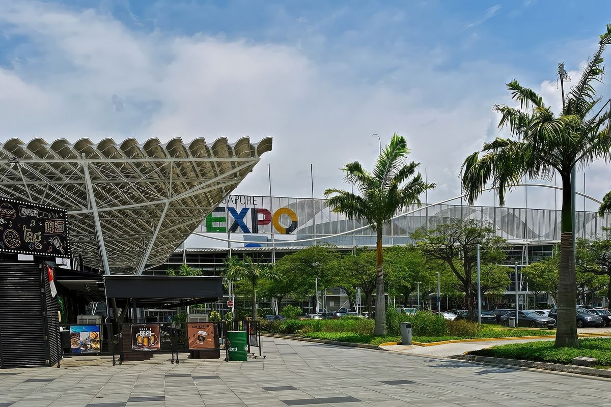 The fan shaped entrance canopy of Singapore EXPO seen from the car park.